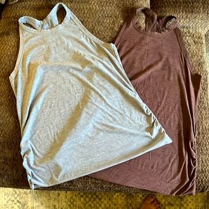 2 Old Navy maternity workout tank tops. Like new. Light blue and purple.